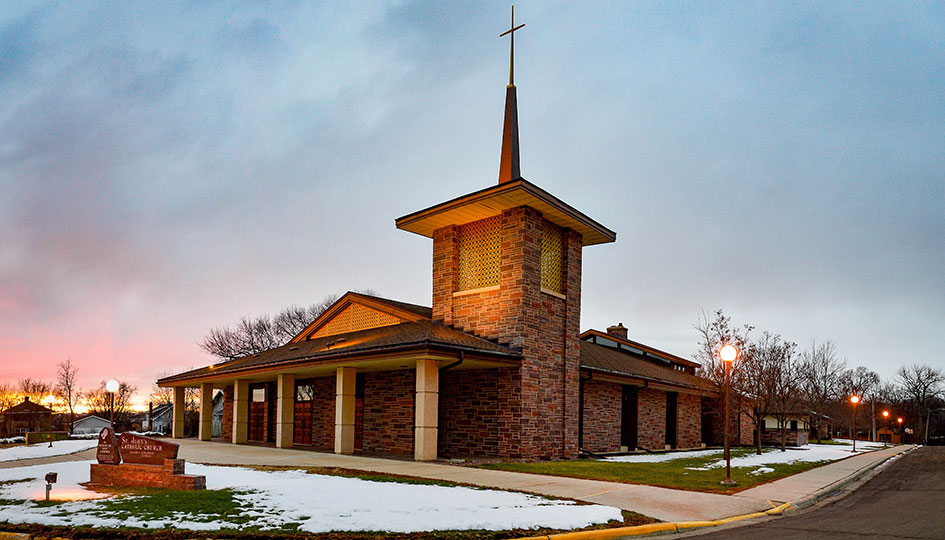 Ortonville St. John’s Catholic Church exterior with brick bell tower and cross