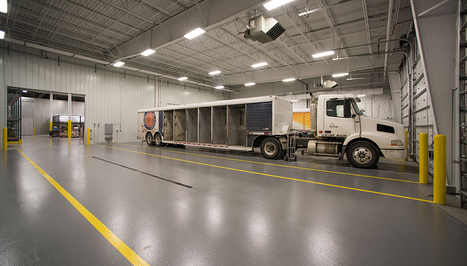 Beverage Wholesalers Alexandria loading dock with delivery truck inside the warehouse