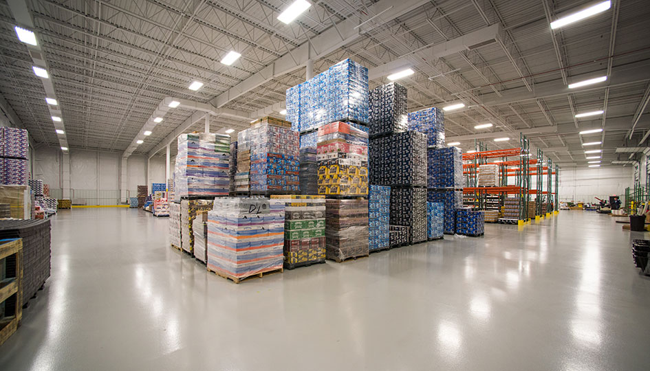 Beverage Wholesalers Alexandria warehouse with stacked pallets and product storage