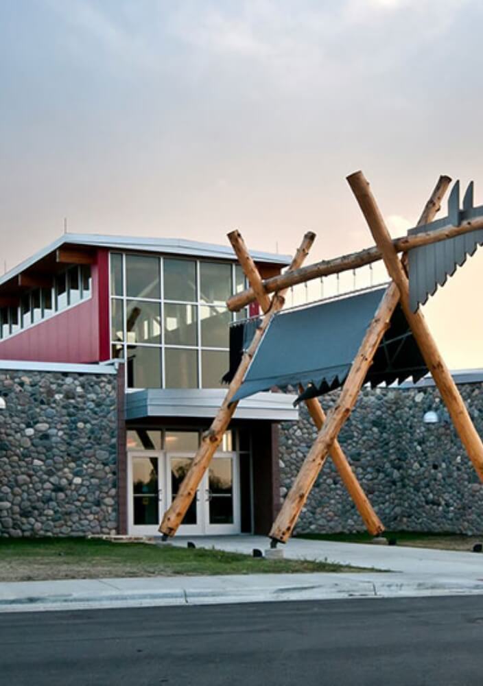 Commercial building with stone exterior and timber entry structure