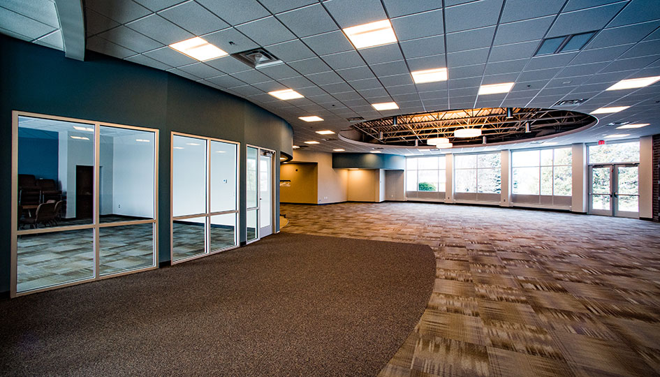 Crosspoint Baptist Church fellowship hall with glass meeting rooms and open seating area