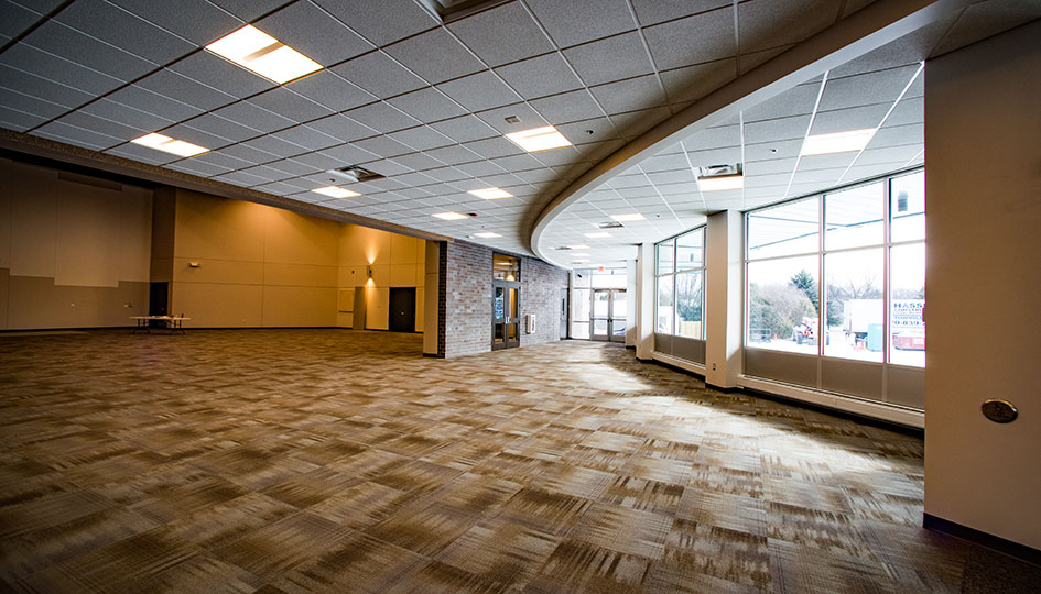 Crosspoint Baptist Church gathering space with large windows and open floor area