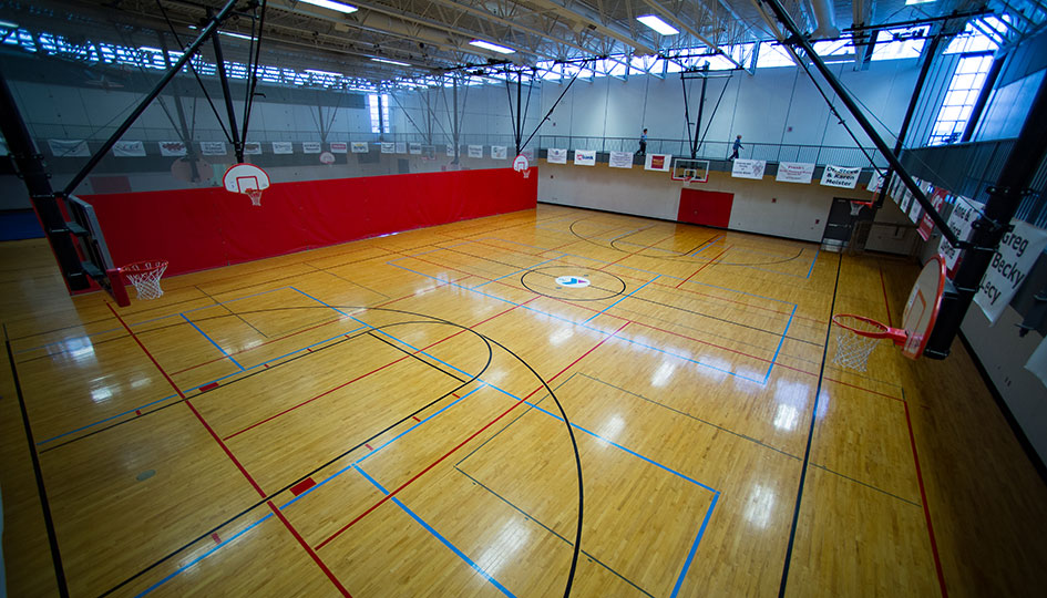 Marshall YMCA gymnasium with basketball courts and overhead hoops