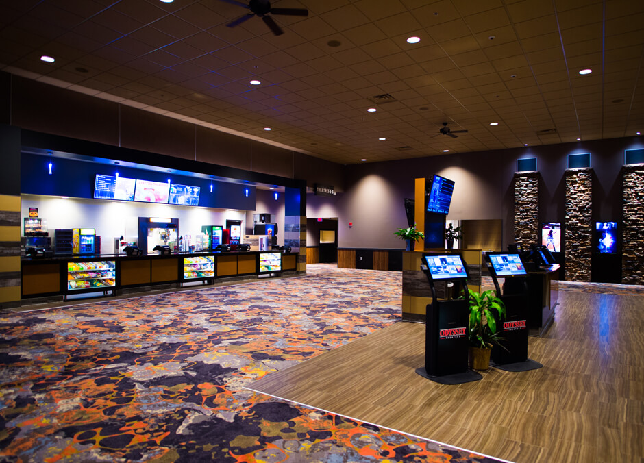 Odyssey Grand 8 Theatre lobby with concession counter and ticket kiosks