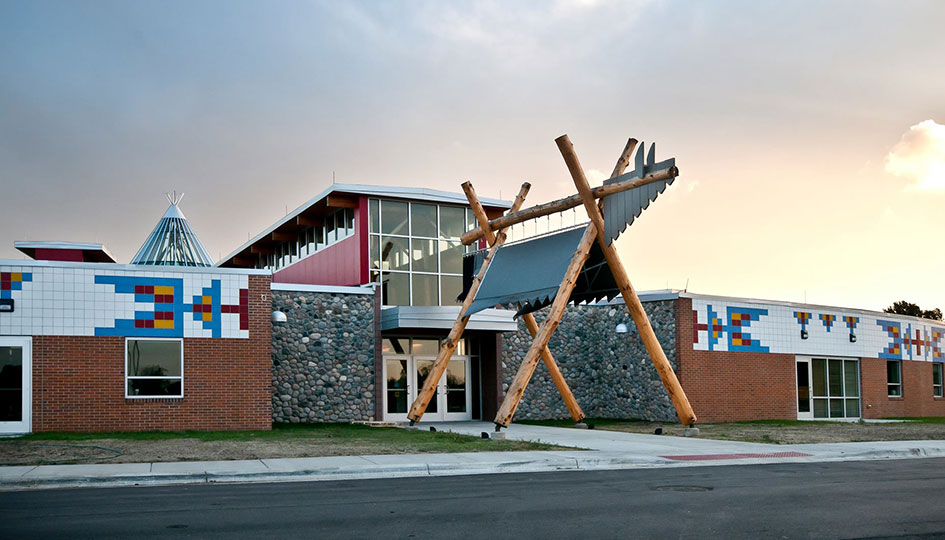 Exterior of the Sisseton Wahpeton Oyate Tribal Administration Building with timber entry feature